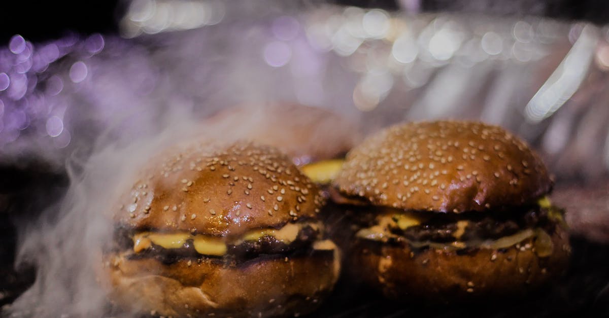 Reheating grilled hamburger patties - Burger on Black Metal Grill