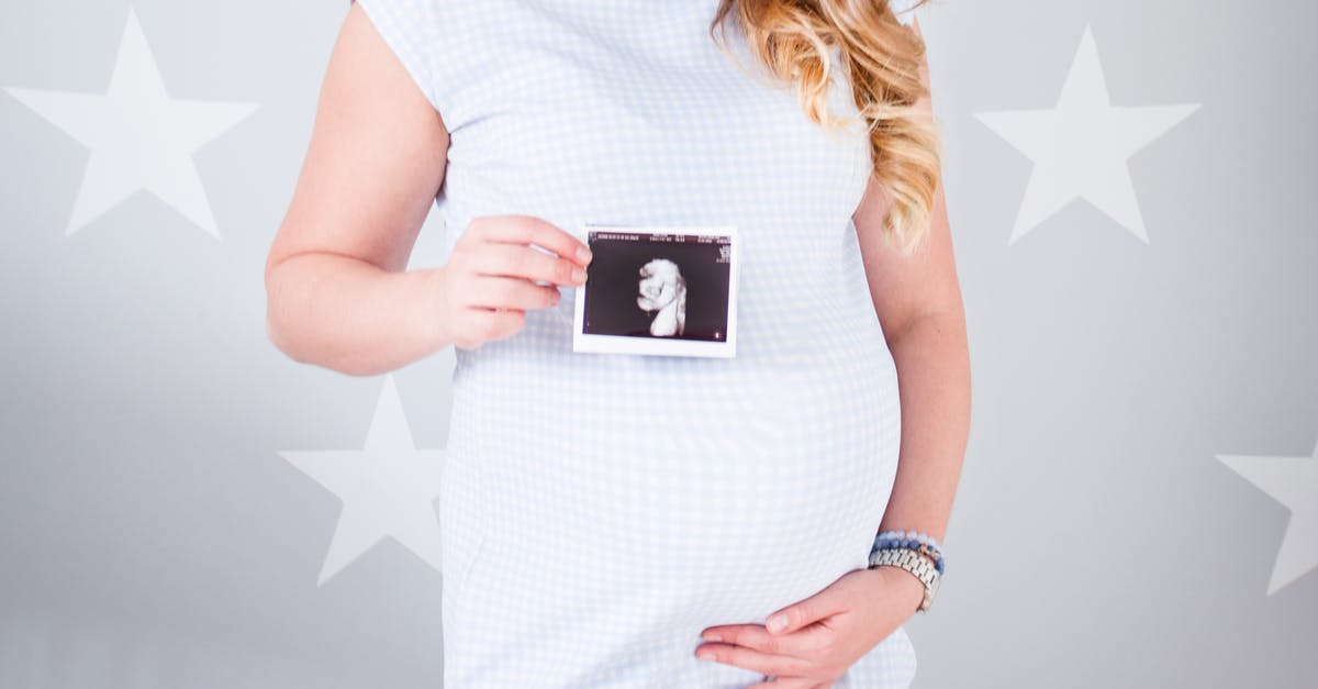 Removing hair from pork belly - Woman Wearing White Cap-sleeved Dress Holding Ultrasound Result Photo