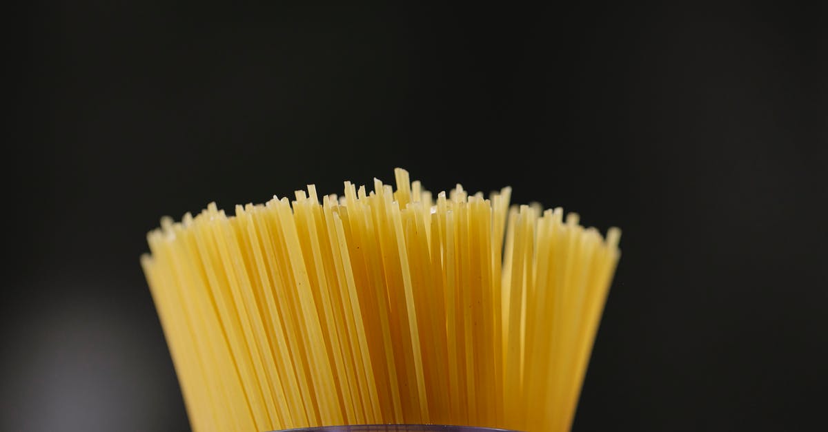 Replacement for pasta that is natural and fairly low carb - Low angle of pile of uncooked spaghetti placed in glass jar against black background