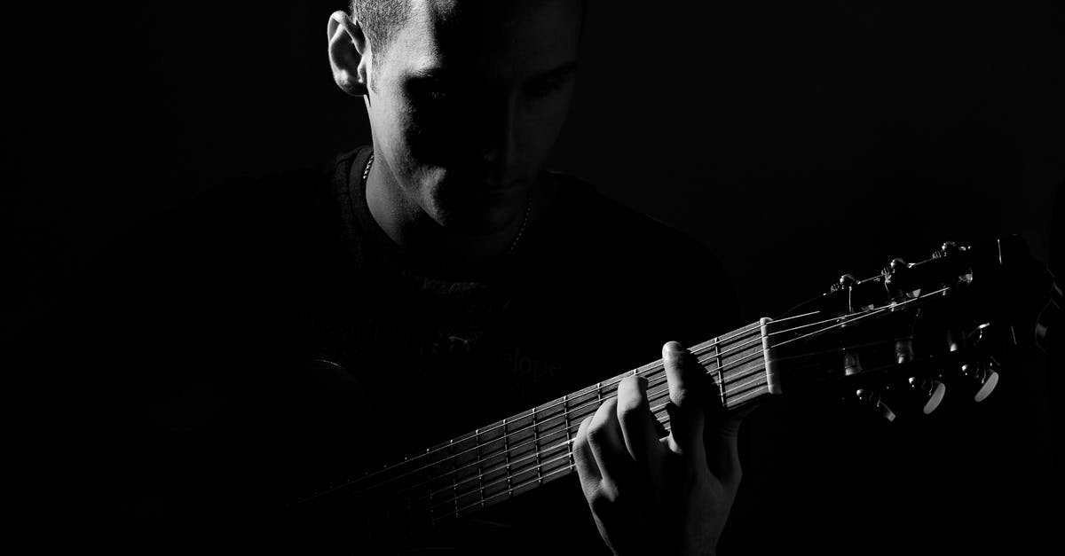 Replacement for pop rocks? - Grayscale Photo of Man Playing Guitar