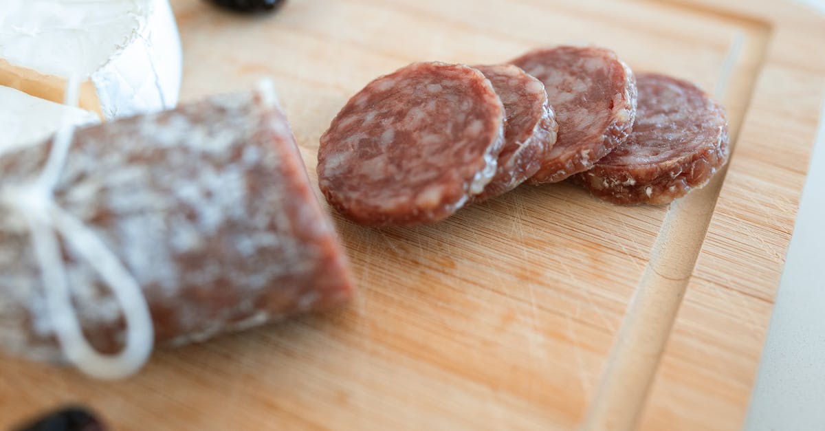 Replacing red wine by vinegar to do a beef salami - 2 Brown Stones on Brown Wooden Table