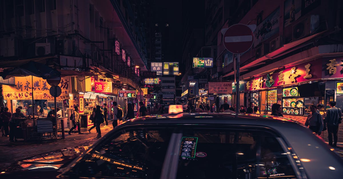 restaurants terms - Photo of Taxi Near Buildings During Nighttime