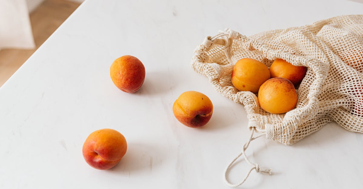 Reuse of Food Grade Tins - Organic sweet apricots in cotton sack placed on table