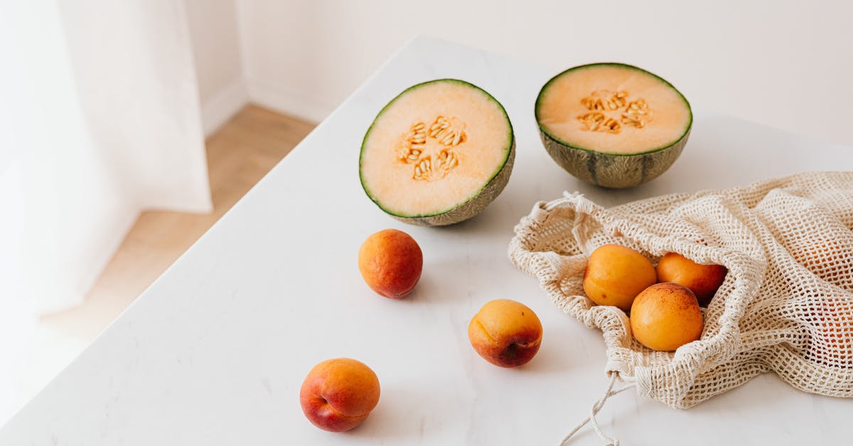 Reuse of Food Grade Tins - Jute sack with ripe apricots on table near halved appetizing melon