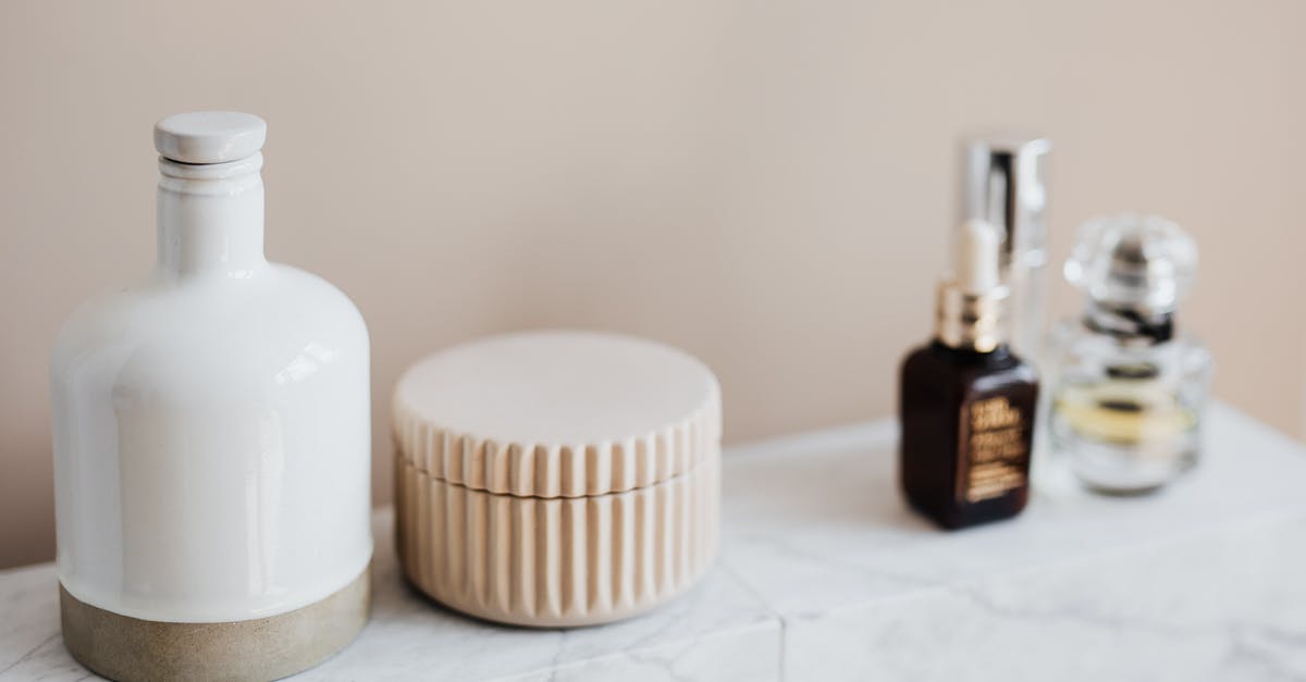 Reusing oil containers - Marble shelf for cosmetics storage in modern bathroom