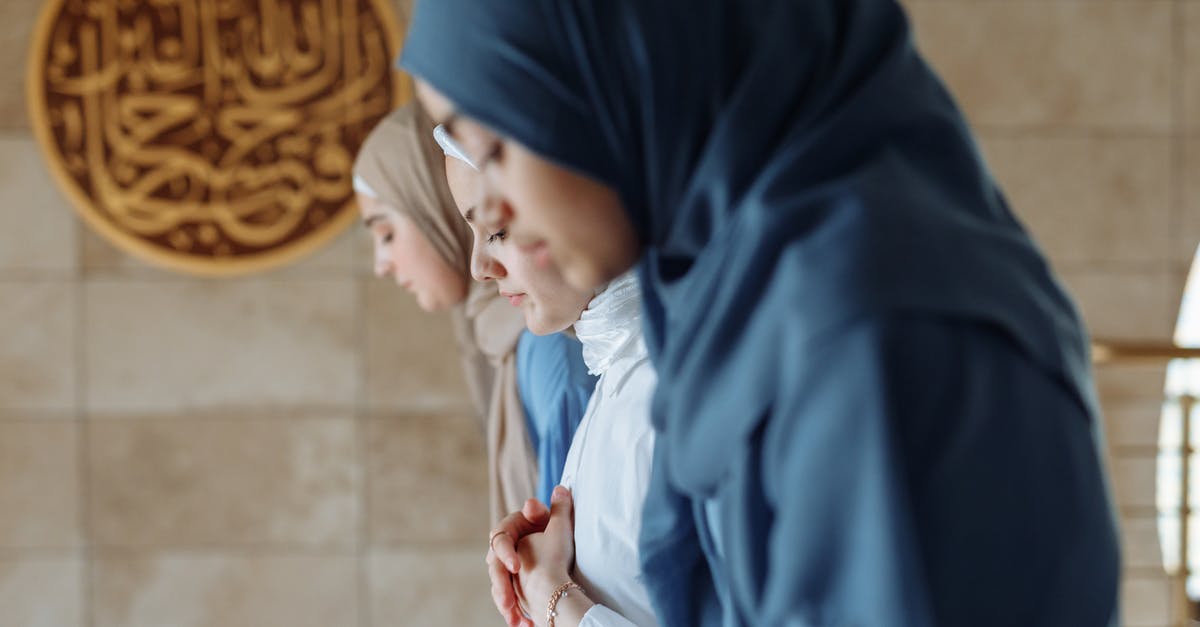 Rib Roast Rare standing up or lying down? - Women Wearing Hijab Standing Next to Each Other while Looking Down