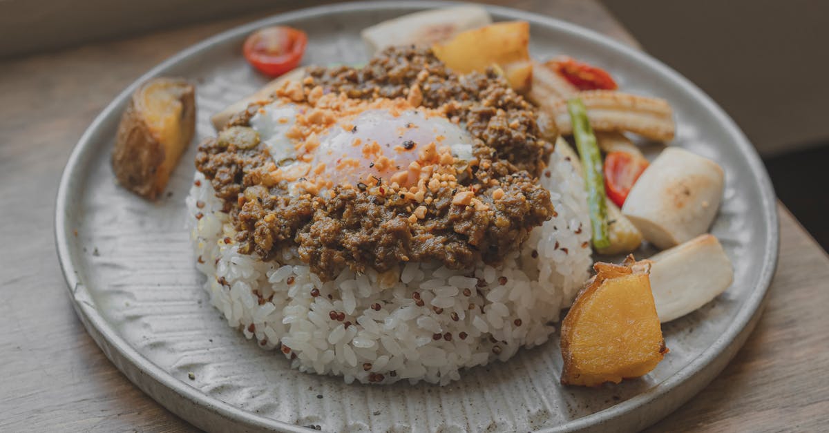 Rice cooker not stopping? - Rice With Fried Egg Toppings on a Plate