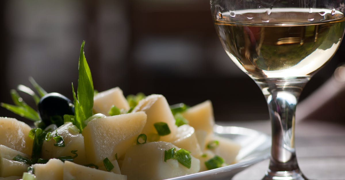 Rice vs pasta and potatoes - Glass of Wine Near Steamed Sliced Potato Dish