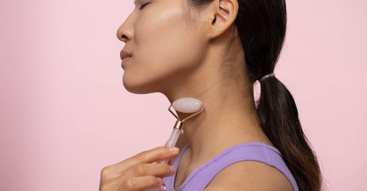 Risk of eating potato skins with anti-germination treatment - Woman in Purple Tank Top Using A Facial Roller On Neck