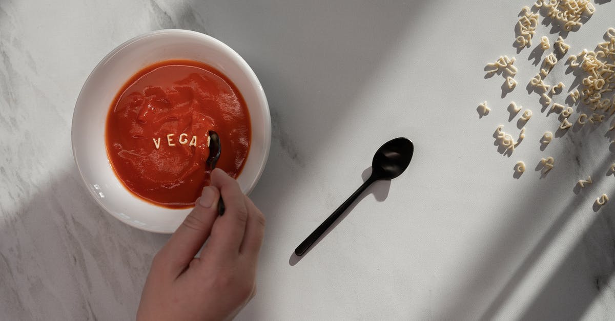 Roast tomato soup without broth/stock - Person Holding White Ceramic Bowl With Red Liquid