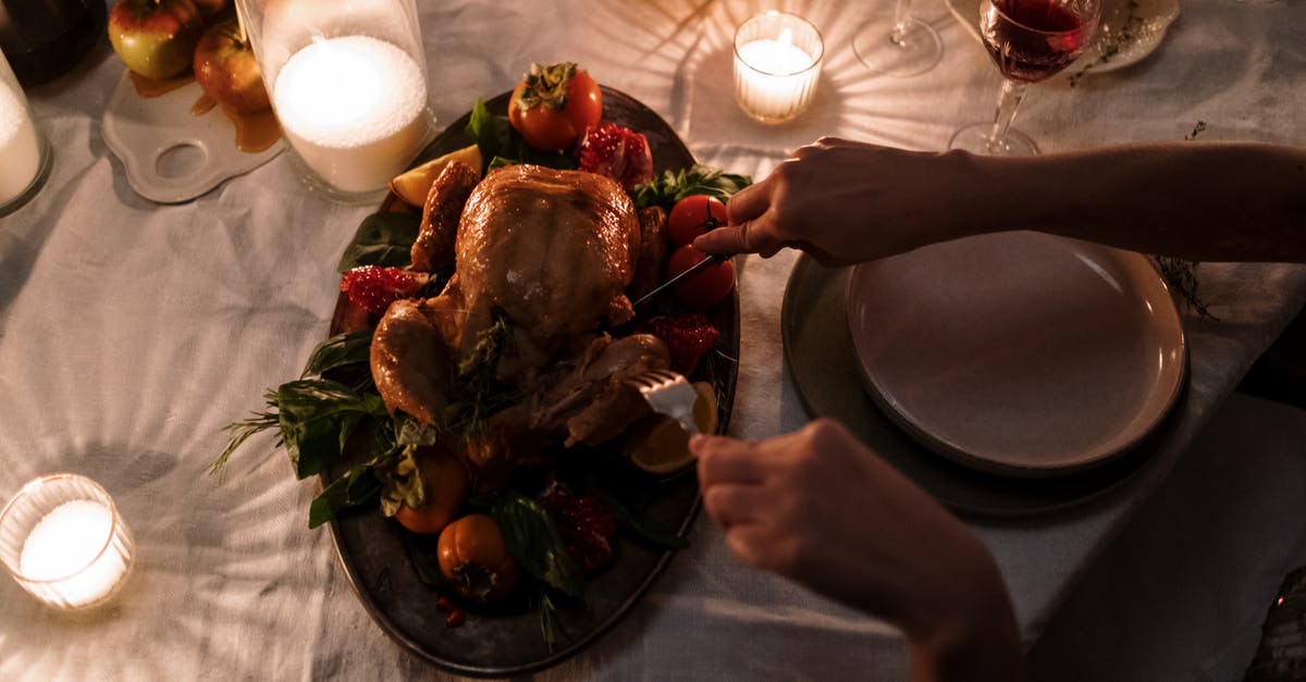 Roasting multiple vegetables at once - Person Slicing the Turkey