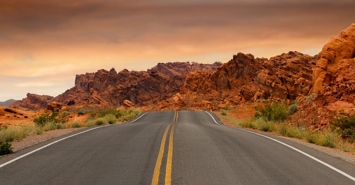 Rocky road seized up? - Gray Concrete Road Beside Brown Mountain during Golden Hour