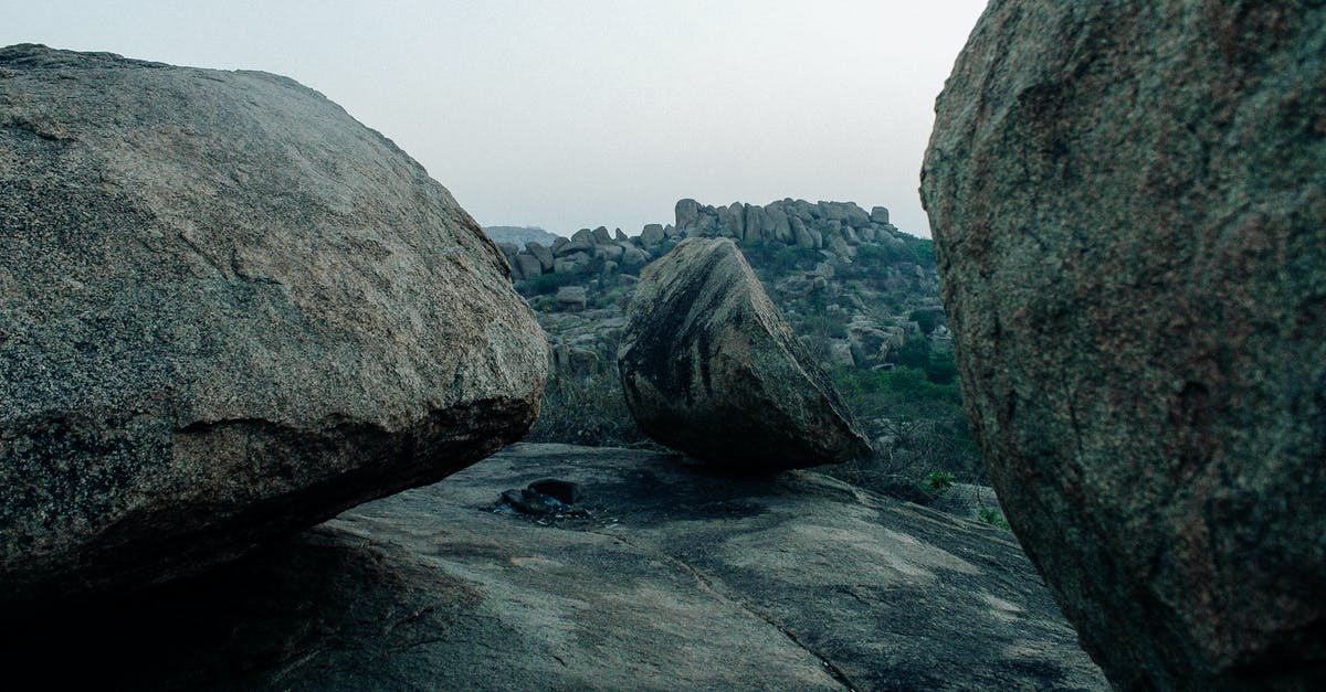 Roughly chopping large batches of hard nuts - Massive stones in mountainous area