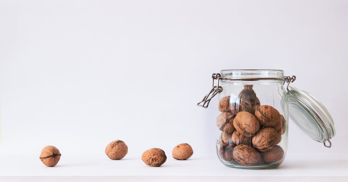 Roughly chopping large batches of hard nuts - Walnut in Clear Glass Jar