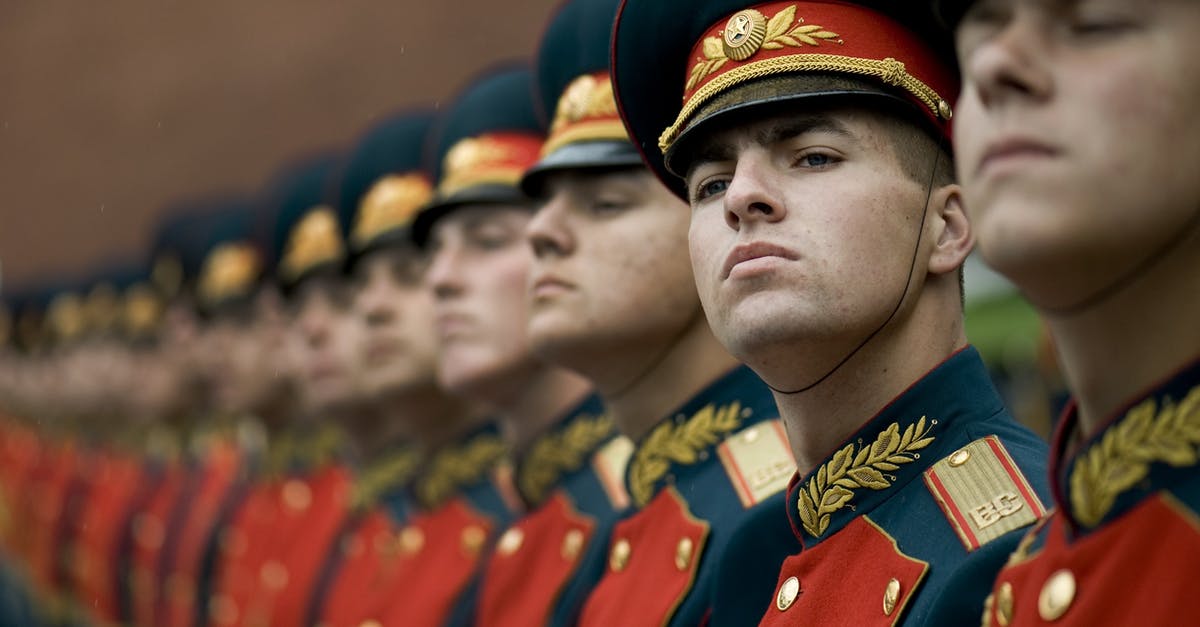 Russian Vobla - ratio for the brine? - Men in Black and Red Cade Hats and Military Uniform