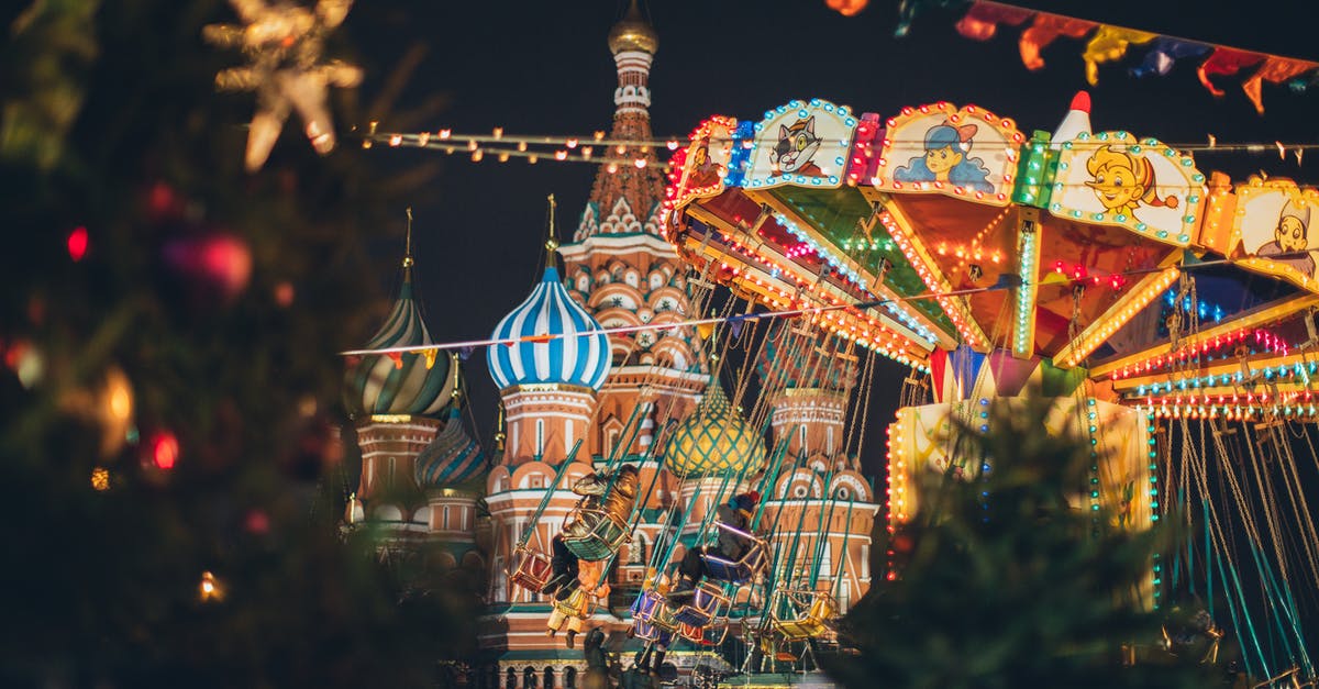 Russian Vobla - ratio for the brine? - Colorful carousel against Cathedral on Red Square at New Year night