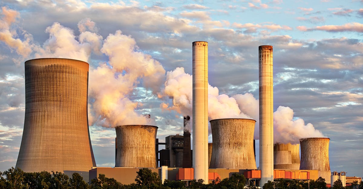 rusty charcoal chimney starter, safe to use? - Landscape Photography of Factory