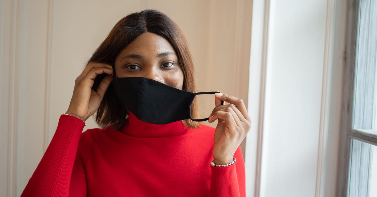 Safe to put honeycomb in tea? - Woman in protective mask in light room