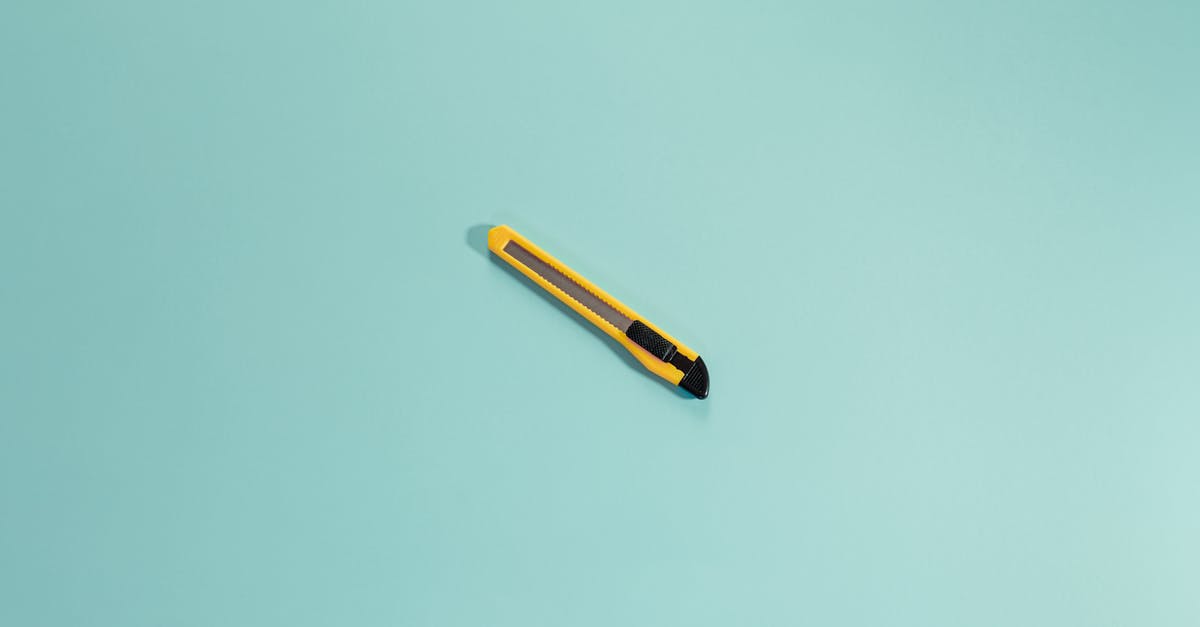 Safety Question about making stainless steel flat-top - From above of yellow stationery knife with sharp blades placed in center of bright empty background in daylight in modern studio