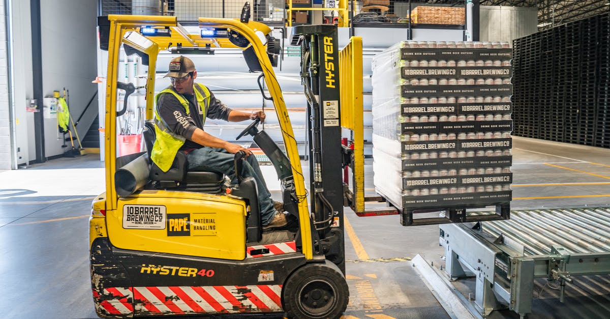 Salinity of brine for feta storage - Person Using Forklift