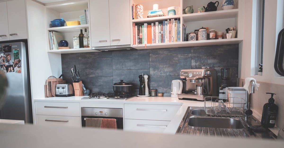 Saucepan in the oven? - Kitchen with minimalist furniture and modern appliances in flat