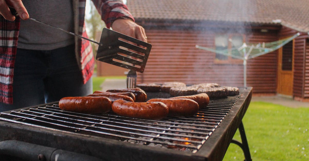 Sausage patties dry when cooked - Person Grilling Sausages and Patties at a Backyard