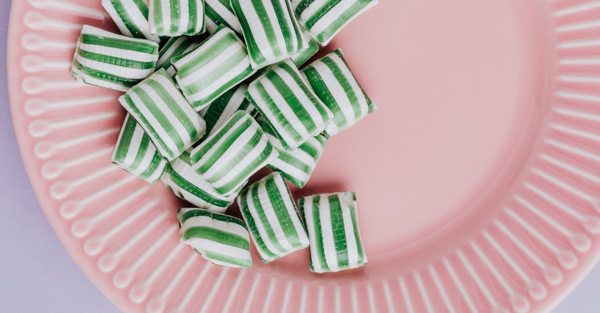 Savoury version of caramel or sugar cage - Set of delicious candies on pink plate