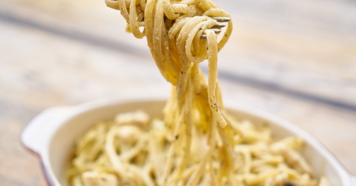 Seeking a creamy/melty Swiss Cheese commonly available in the US - Close-Up Photography Of Pasta With White Sauce