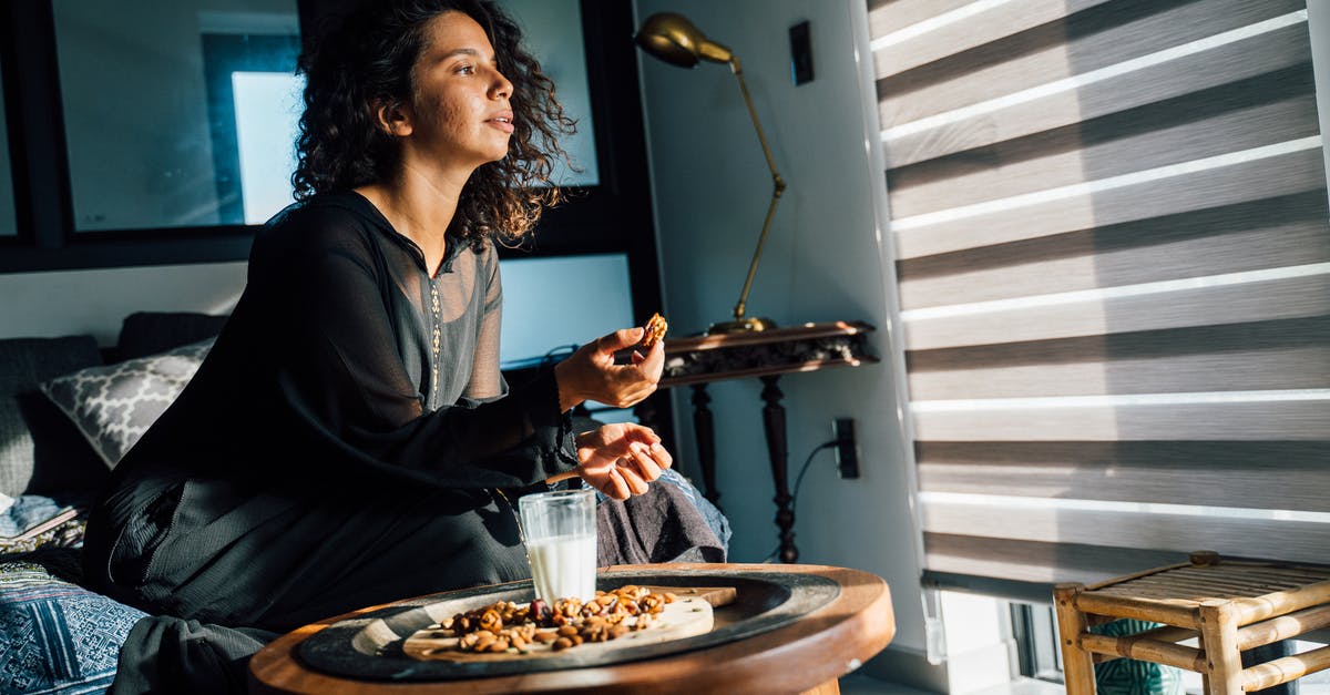 Selecting nuts for successful home oven-roasting - A Woman Sitting on the Couch Eating 