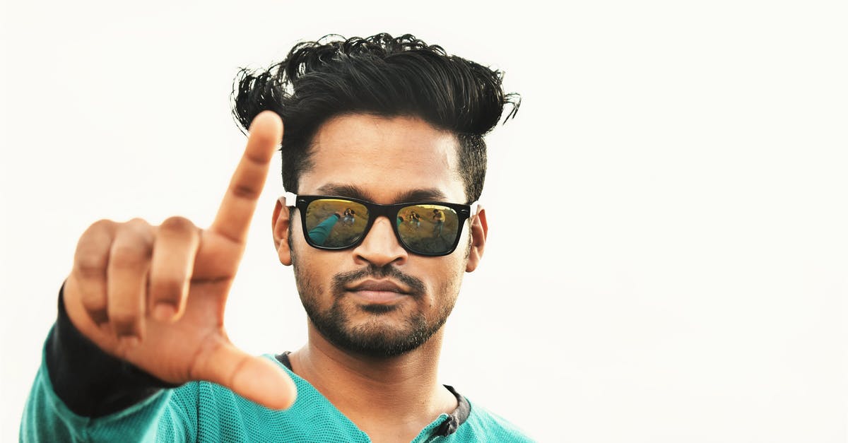 Self-cooked chickpeas not as good as canned? - Serious ethnic man showing fingers sign against white background