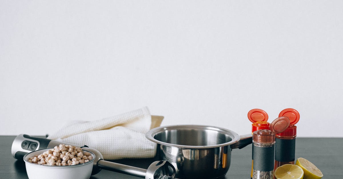 Sesame Oil vs Toasted Sesame Oil - Stainless Steel Cup Beside White Ceramic Bowl