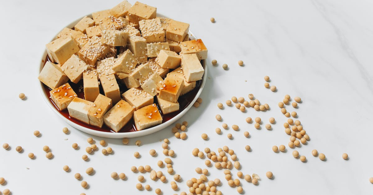 Sesame soy vinegarette - Sliced Tofu with Sesame Seeds on White Plate 