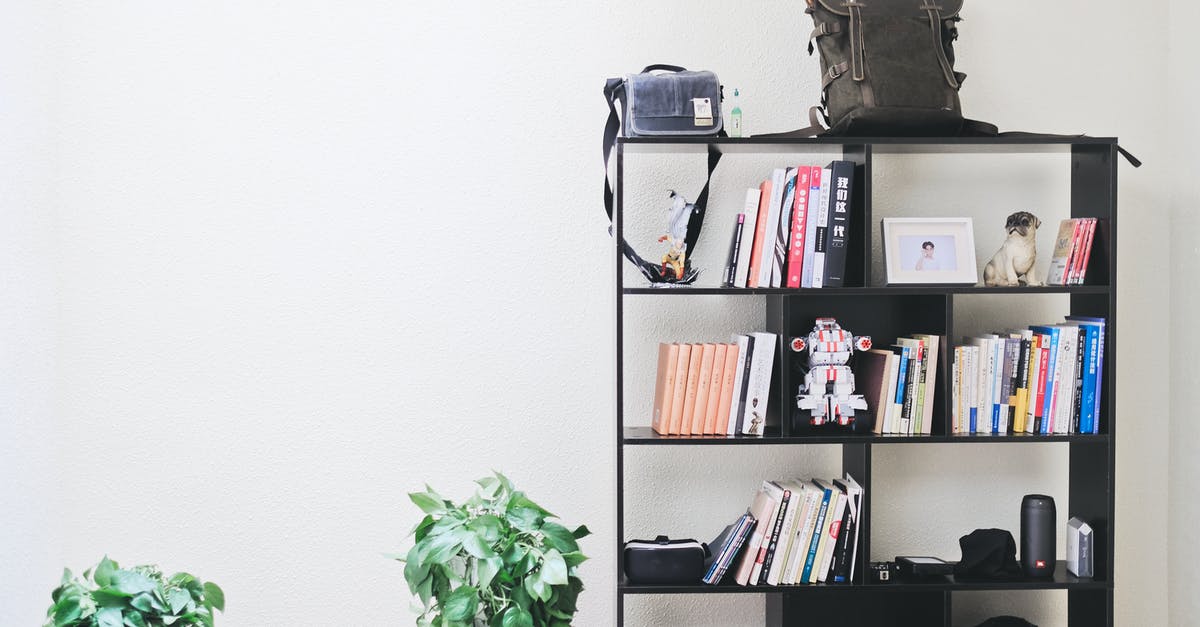 Shelf life of marmalade - Books and Speakers on Black Wooden Shelf