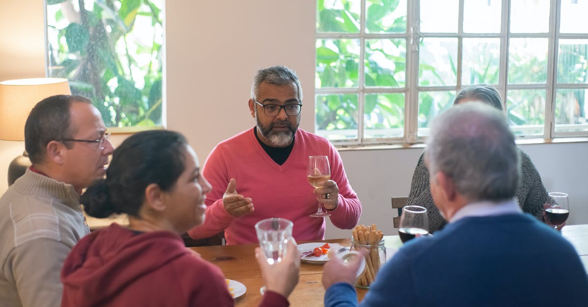 Sherry Wine vs Sherry Vinegar - Man in Red Sweater Sitting Beside Woman in Black Framed Eyeglasses