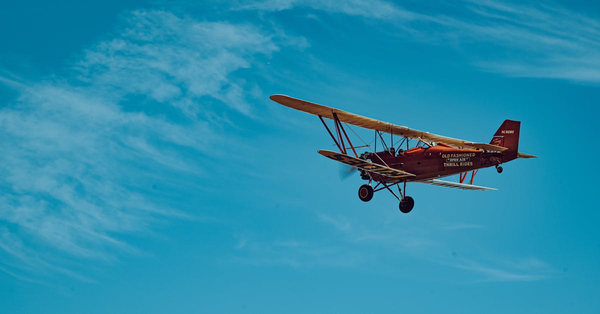 Should an Aviation include Crème de Violette? - Orange and White Airplane in Mid Air