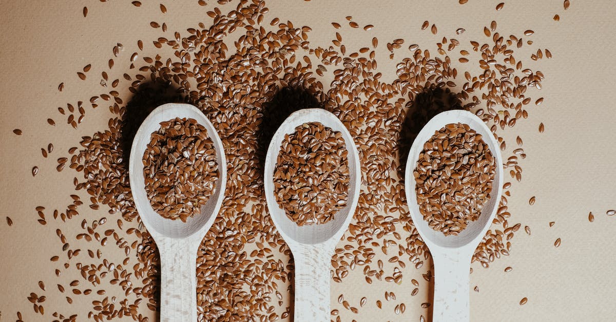 Should flax seeds be crushed to be a good egg substitute? - Three Wooden Spoons with Flax Seeds