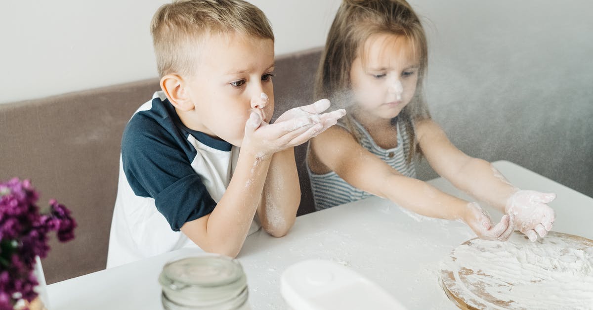 Should flour be thrown out past its expiry date? - A Boy Blowing Off Flour on His Hands