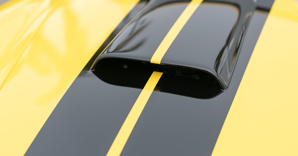 Should I always run the exhaust / hood fan when cooking? - Close Up Shot of a Yellow Car