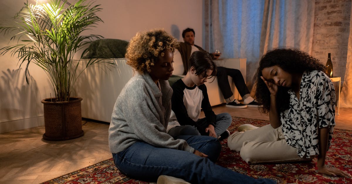 Should I be concerned about drinking tap water? - People Sitting on Floor Inside Room