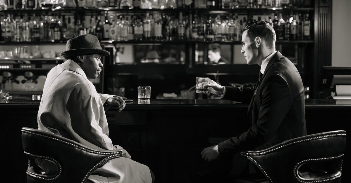 Should I be suspicious of meat/seafood on sale? - Monochrome Photo of Men Sitting in Front of Bar Counter