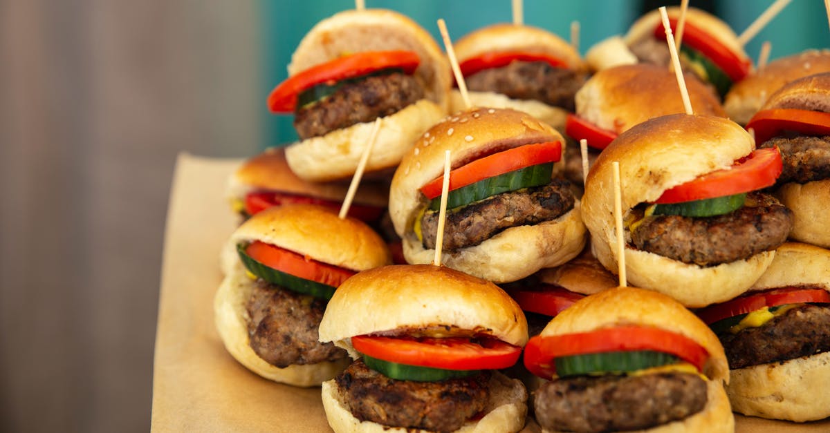 Should I boil beef for burgers before marinating? [closed] - Selective Focus Photography of Pile of Burgers