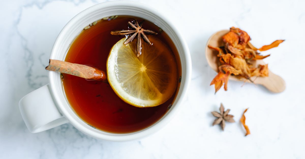 Should I crush the spice for Chai Tea Latte? - White Ceramic Mug With Tea and Sliced Lemon