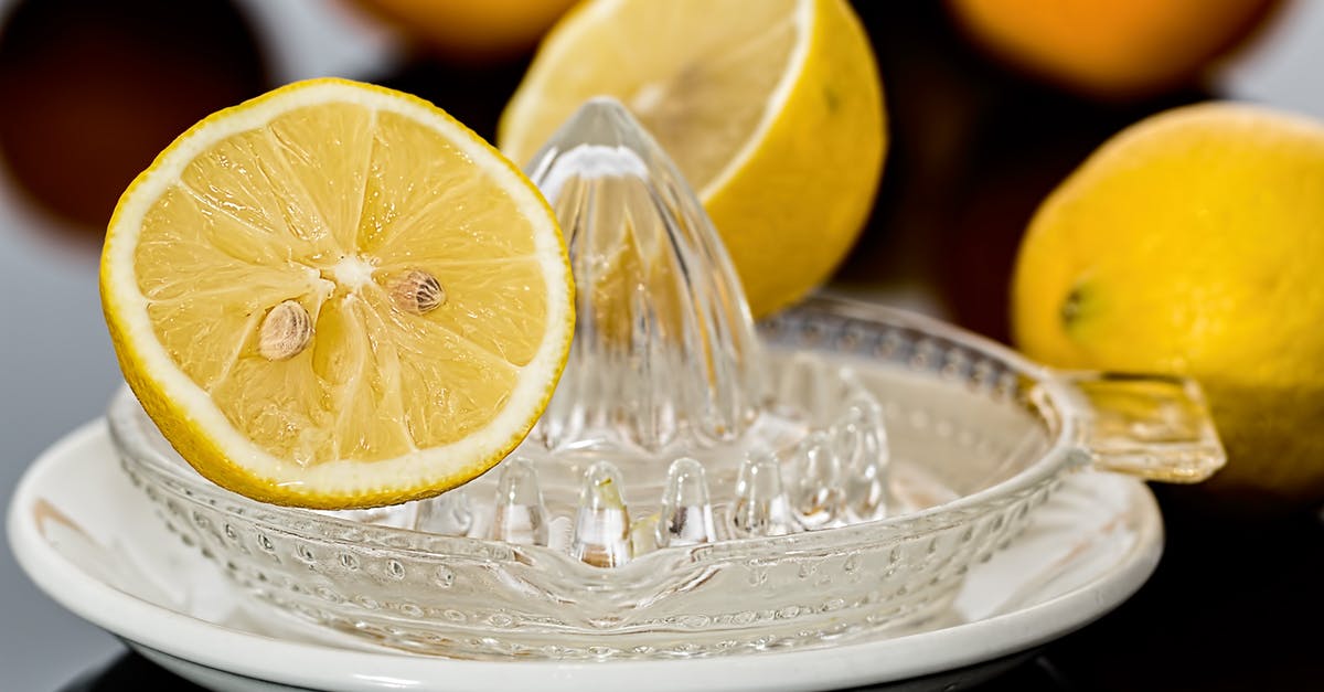 Should I get masticating or a citrus juicer? - Yellow Lemonade on Clear Glass Saucer