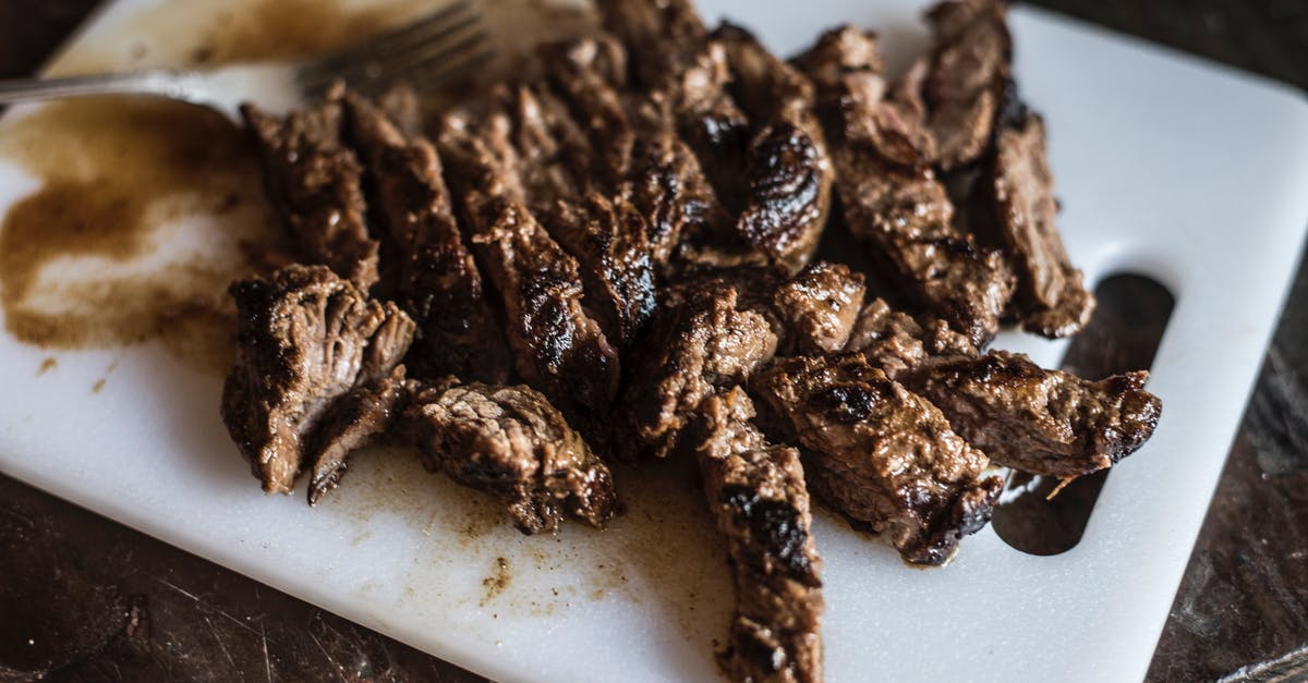 Should I marinate or dry-brine a steak first? - Marinated Steak Bites on White Platter in Close Up Photography