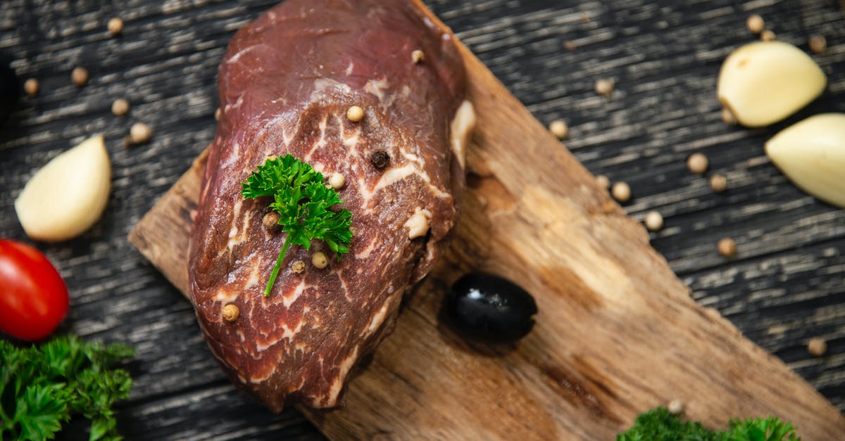 Should leftover meat be stored in cooking juices? - Raw Meat on Brown Wooden Chopping Board