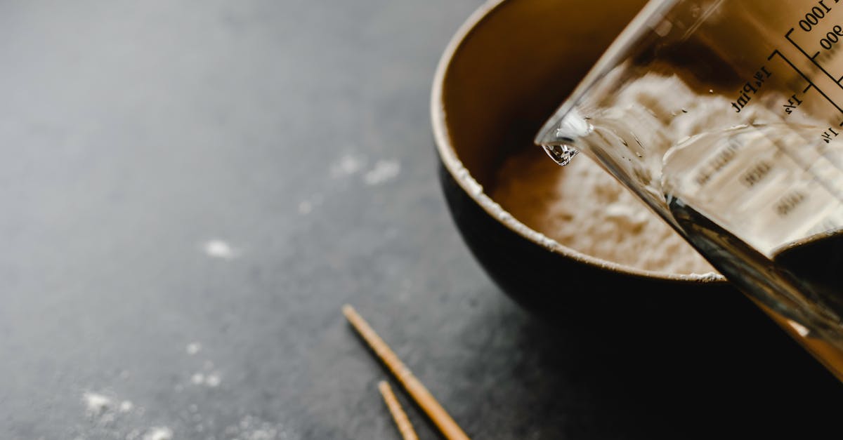 Should we start making dough with water or with flour? - Stainless Steel Bowl With Brown Liquid