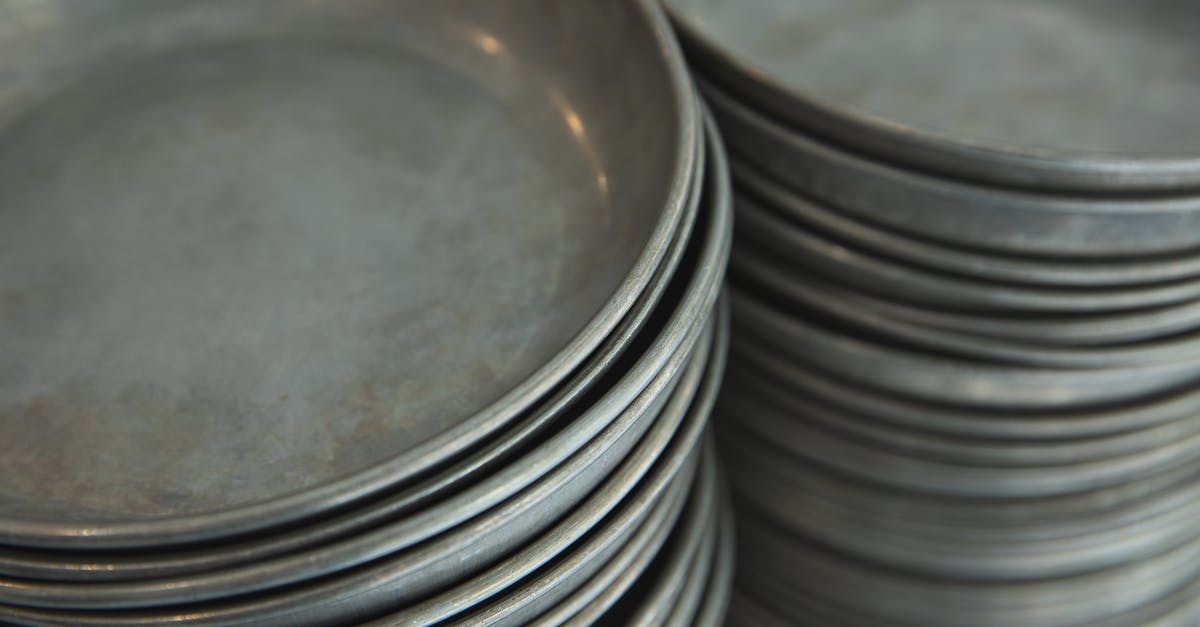 Should you store cutlery upside down? - Rows of many dishware in kitchen