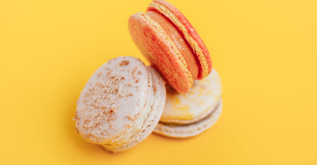 Should you stream sugar into French meringue? - From above of delicious little homemade macaroons placed on bright yellow background of studio