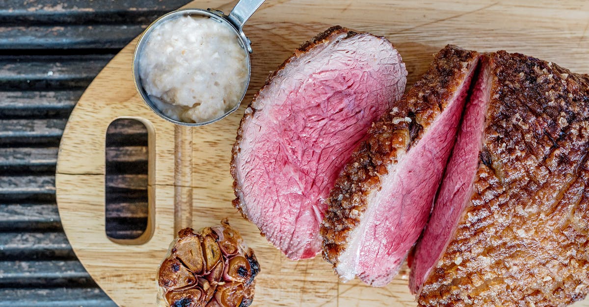 Simulating the discontinued Lawry's Roasted Garlic Salt? - Sliced Roasted Meat on Brown Wooden Chopping Board