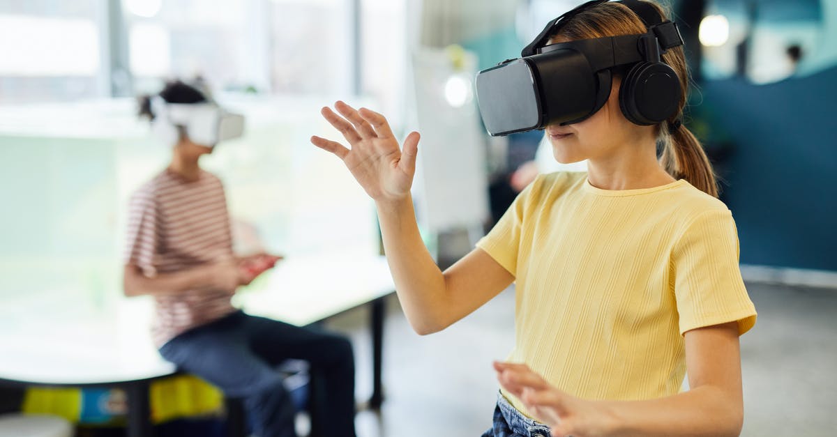 Siphon for testing new recipes: 250ml or 500ml? [closed] - Young female in VR glasses standing in light room and testing new device